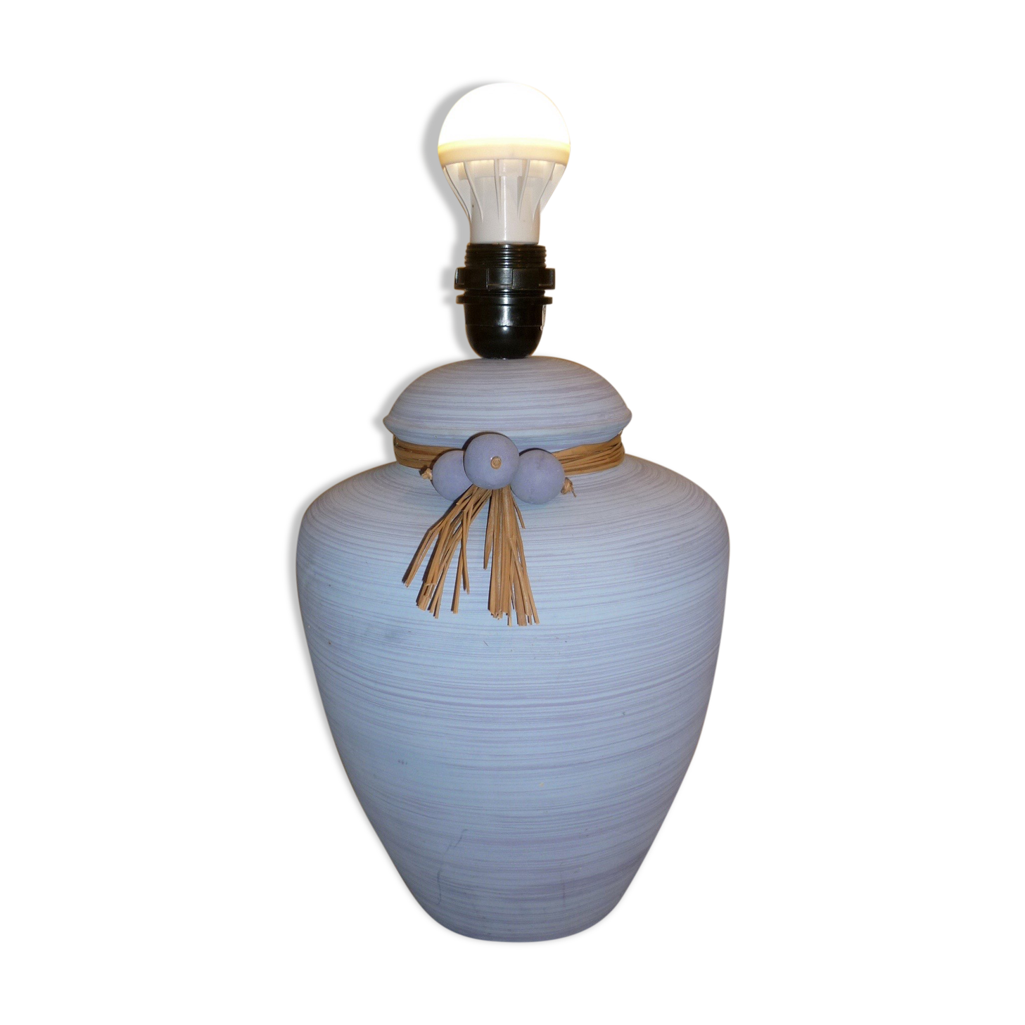 Vintage ceramic lamp foot with ball necklace and raffia.