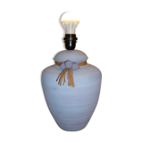 Vintage ceramic lamp foot with ball necklace and raffia.