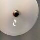 A set of hanging lamps in milky white opal glass with brass top.