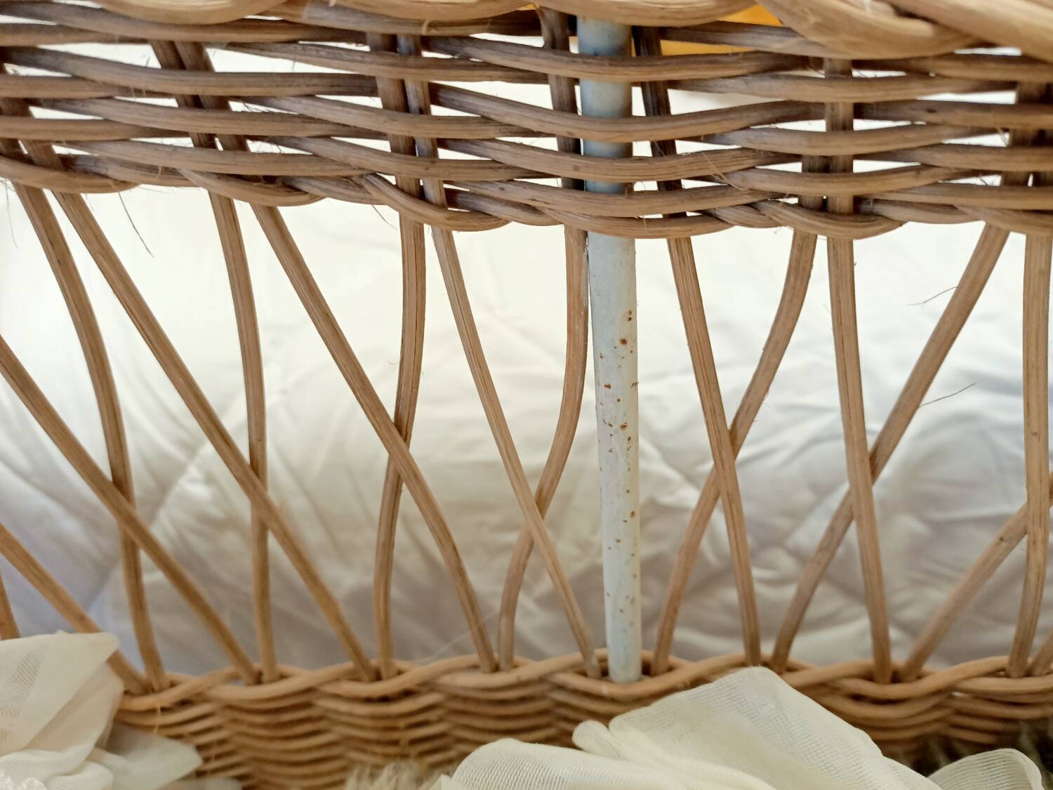 Rattan and wrought iron cradle