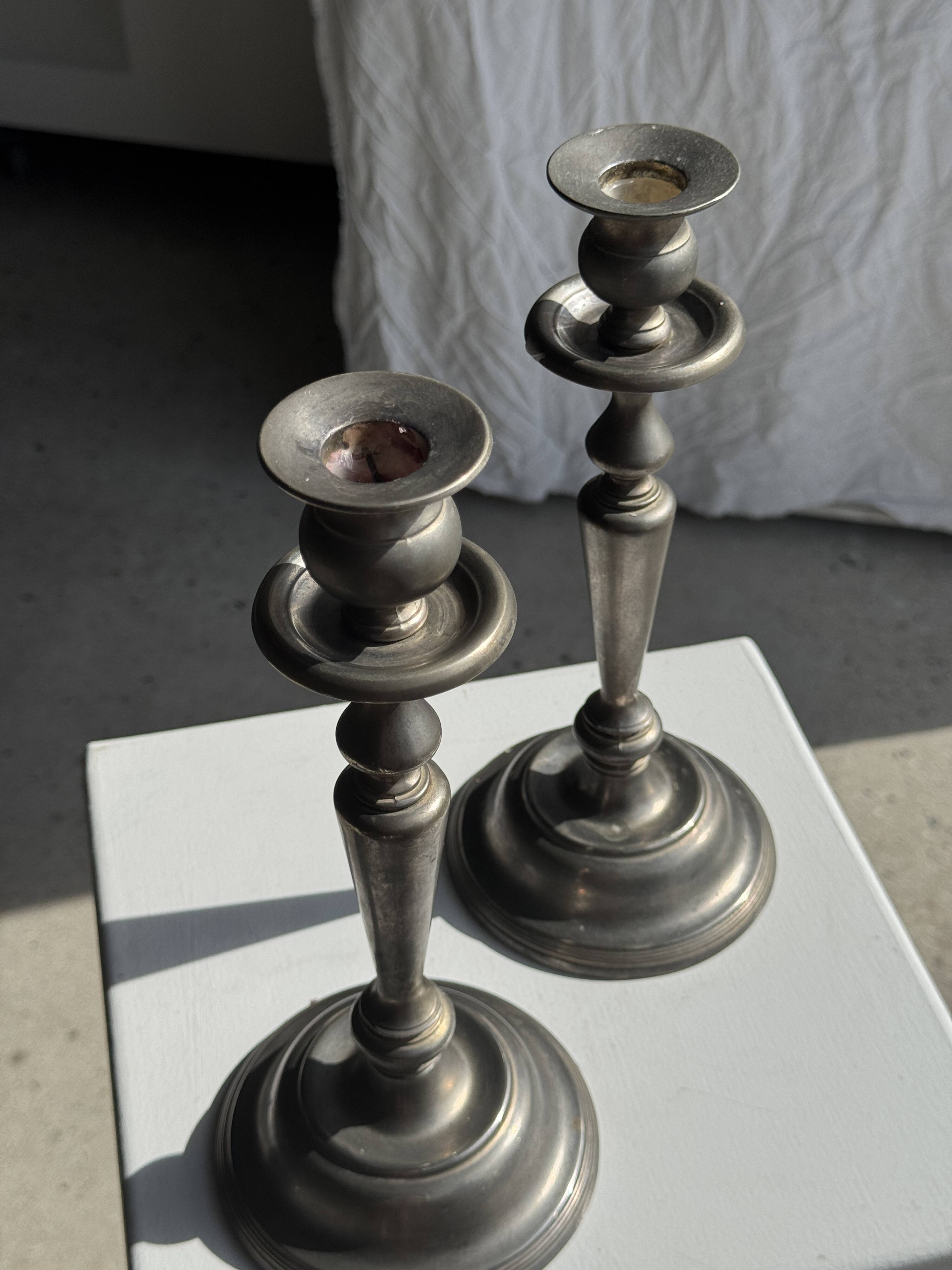 Two large antique silver-plated metal candlesticks, H30