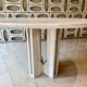 Round travertine dining table by Claude Berraldacci