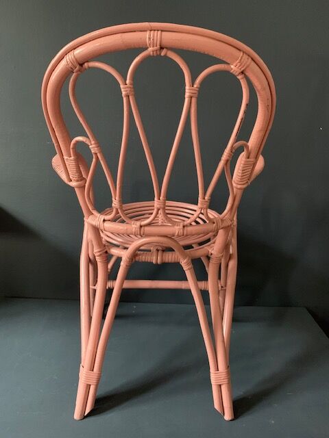 Vintage pink rattan armchair
