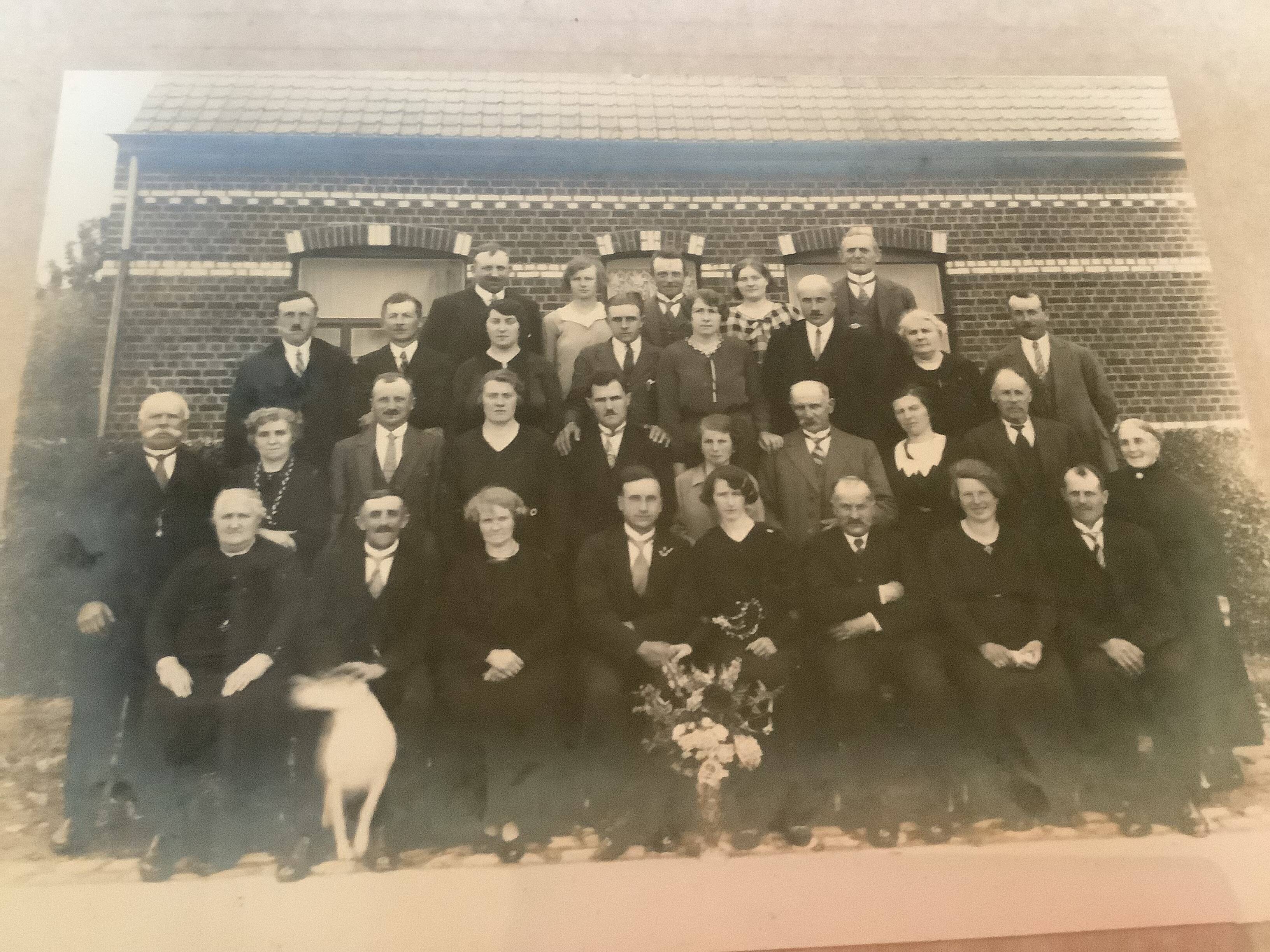 Old photograph of a newlywed couple with a dog