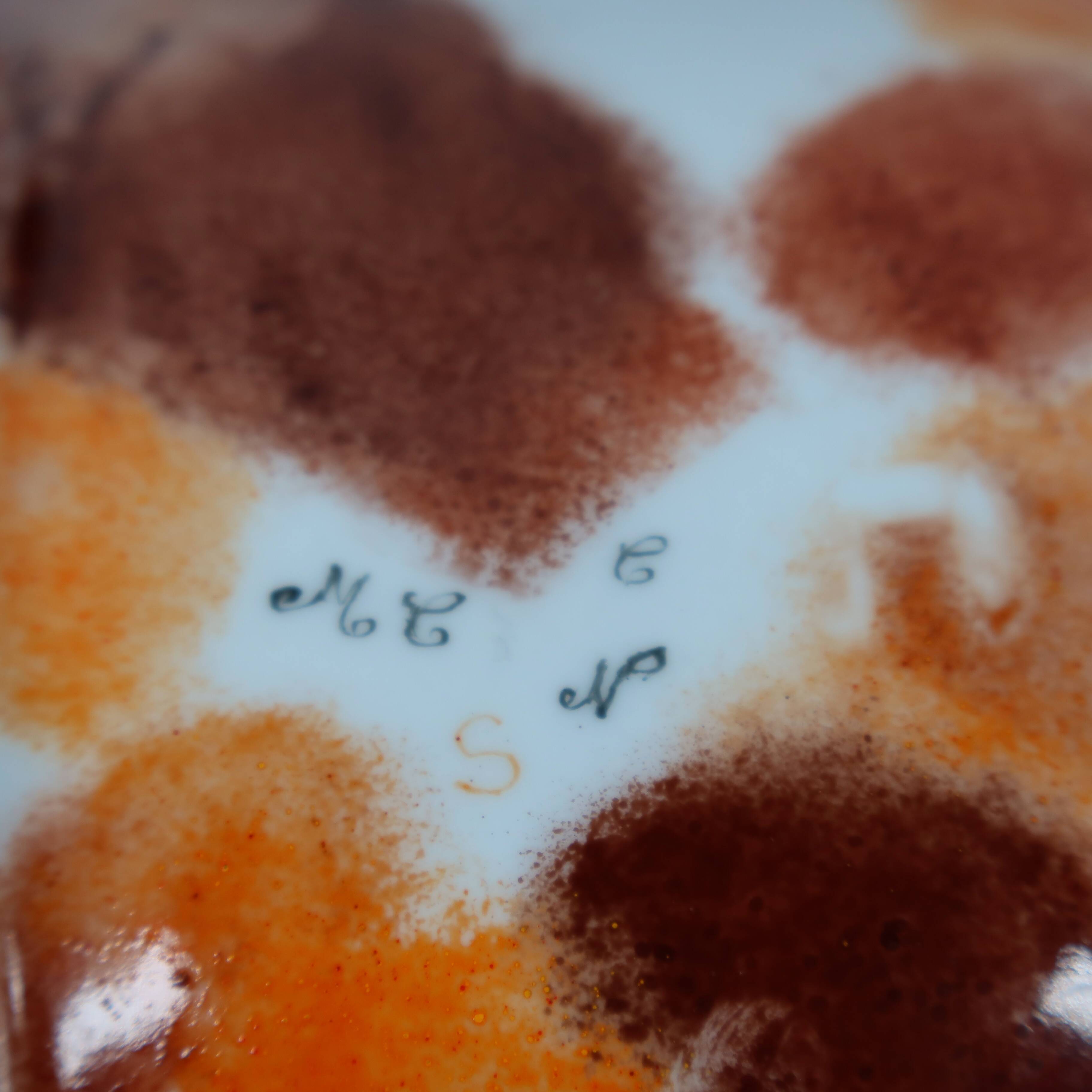 Handcrafted ceramic trinket dish in shades of brown and orange