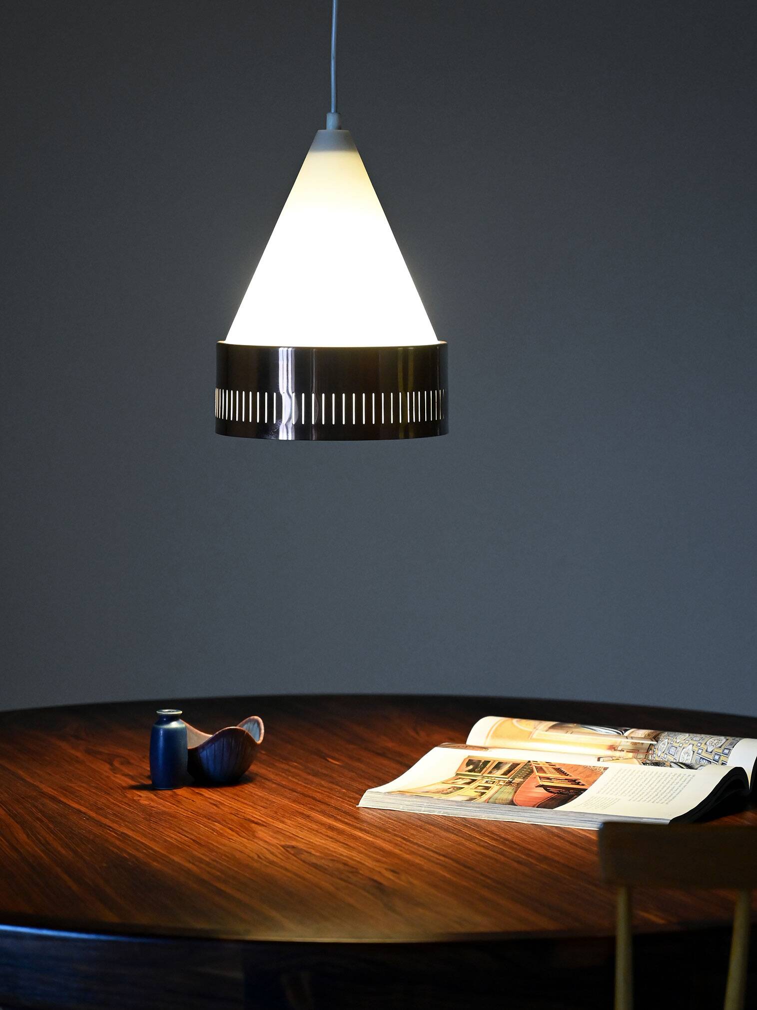 Scandinavian conic pendant lamp with copper detail