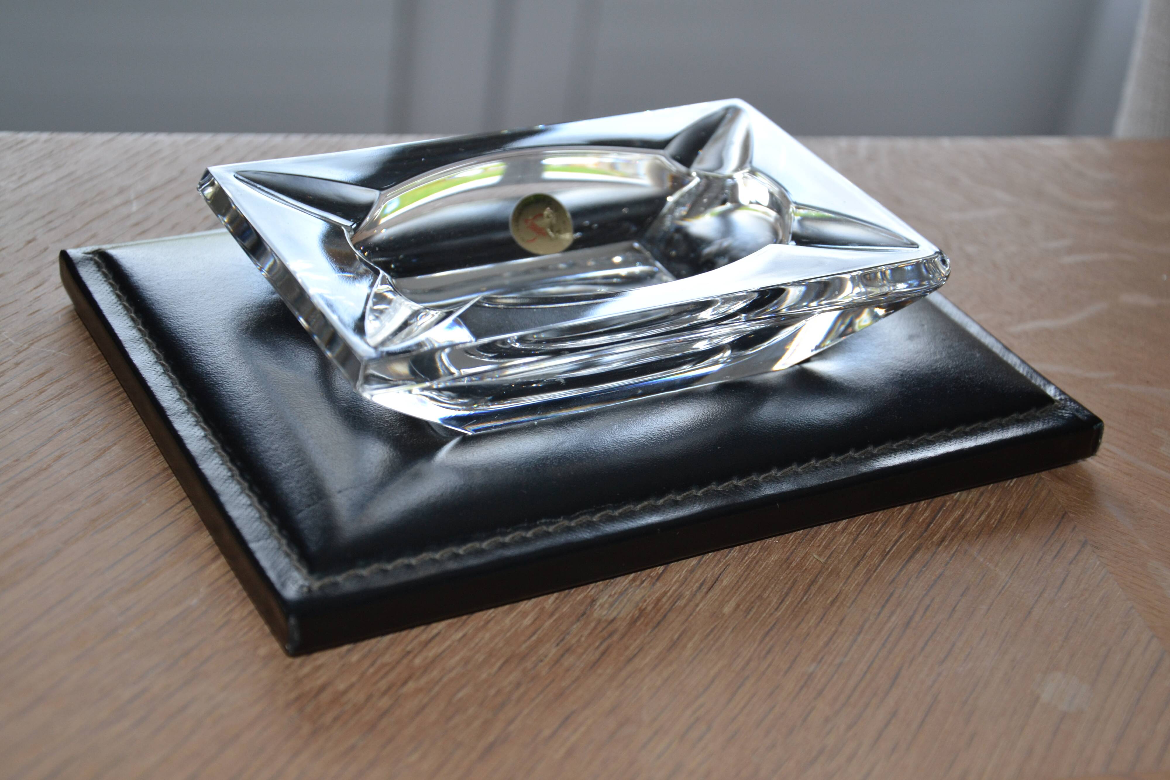 Antique crystal ashtray with its leather stand