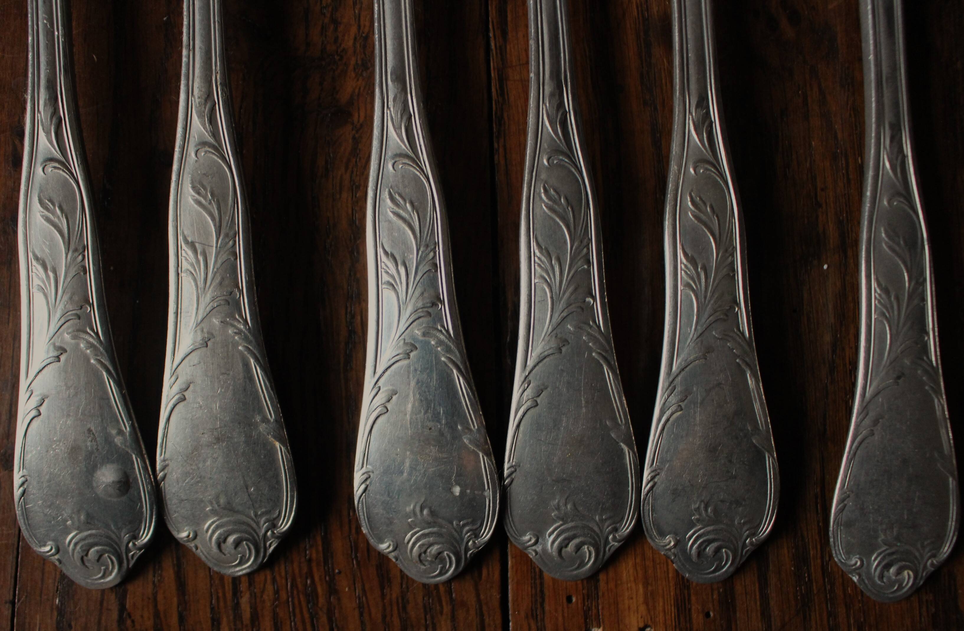 A set of 6 old flowered metal forks