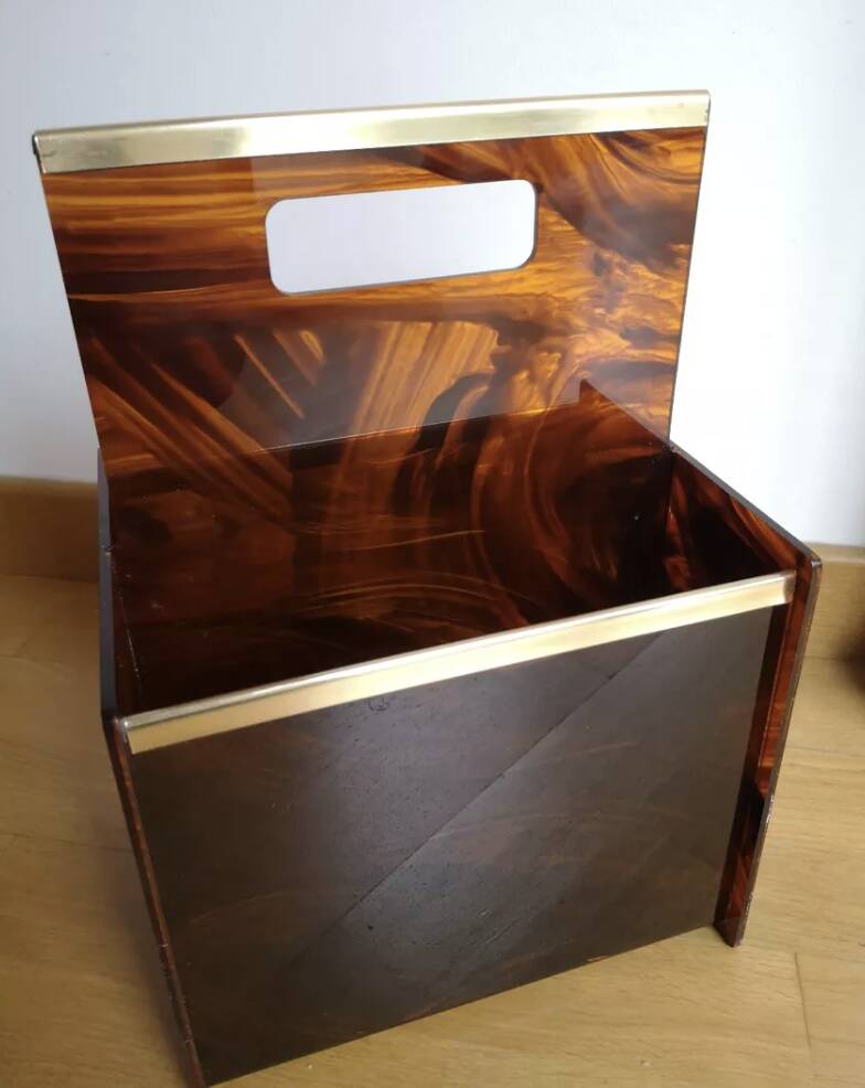 Tortoiseshell lucite magazine rack from the Christian Dior Home collection.