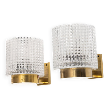 Carl Fagerlund for Orrefors Pair of wall lights in brass and glass Sweden 1960