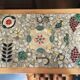 New oak storage furniture with a signed artisanal mosaic top.