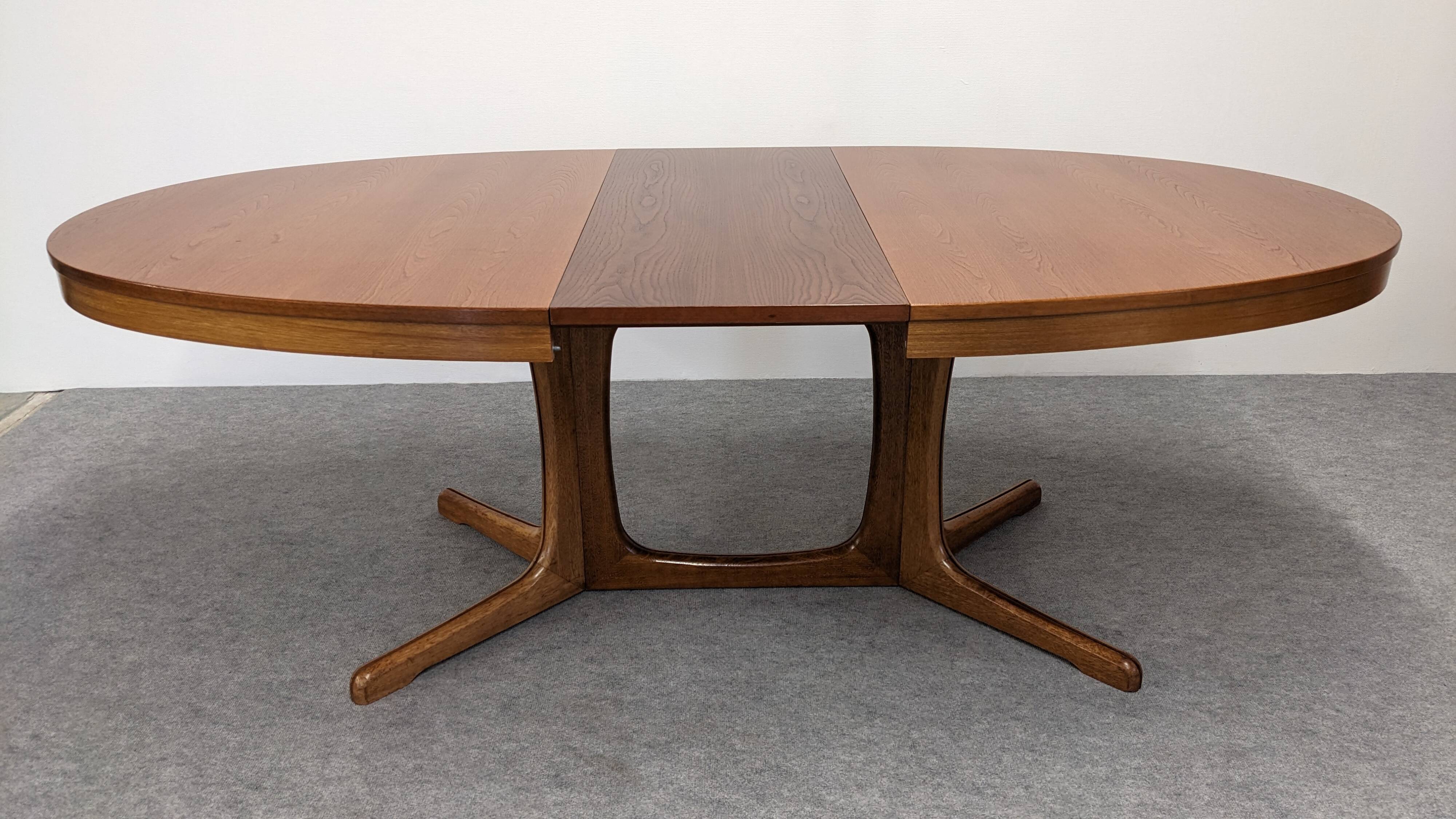 Oval extendable dining table by Baumann, France circa 1970.