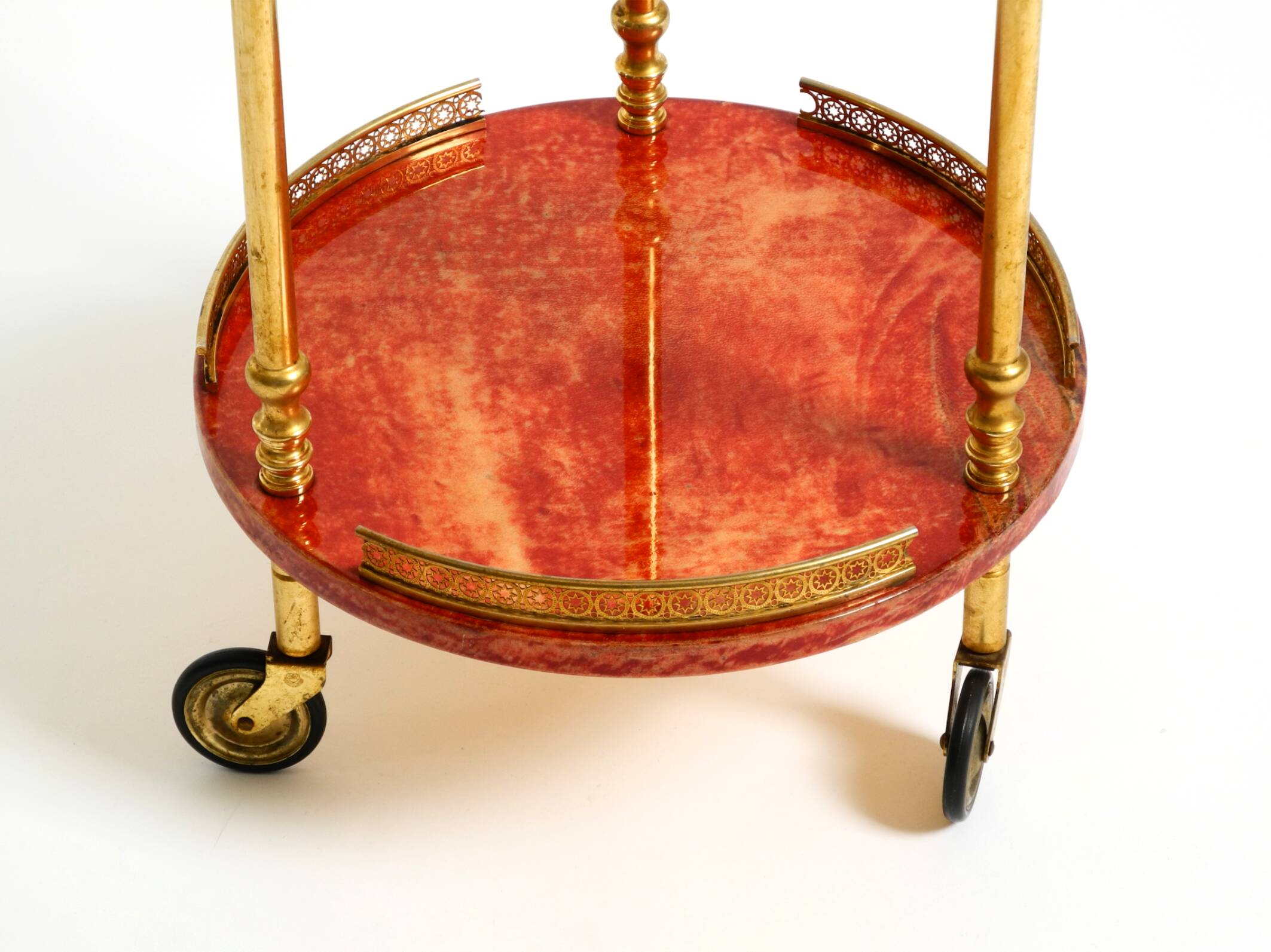 Round, small 1960s Aldo Tura serving or bar trolley in red goatskin leather