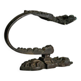 Antique black patinated metal coat hook.