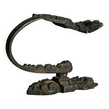 Antique black patinated metal coat hook.