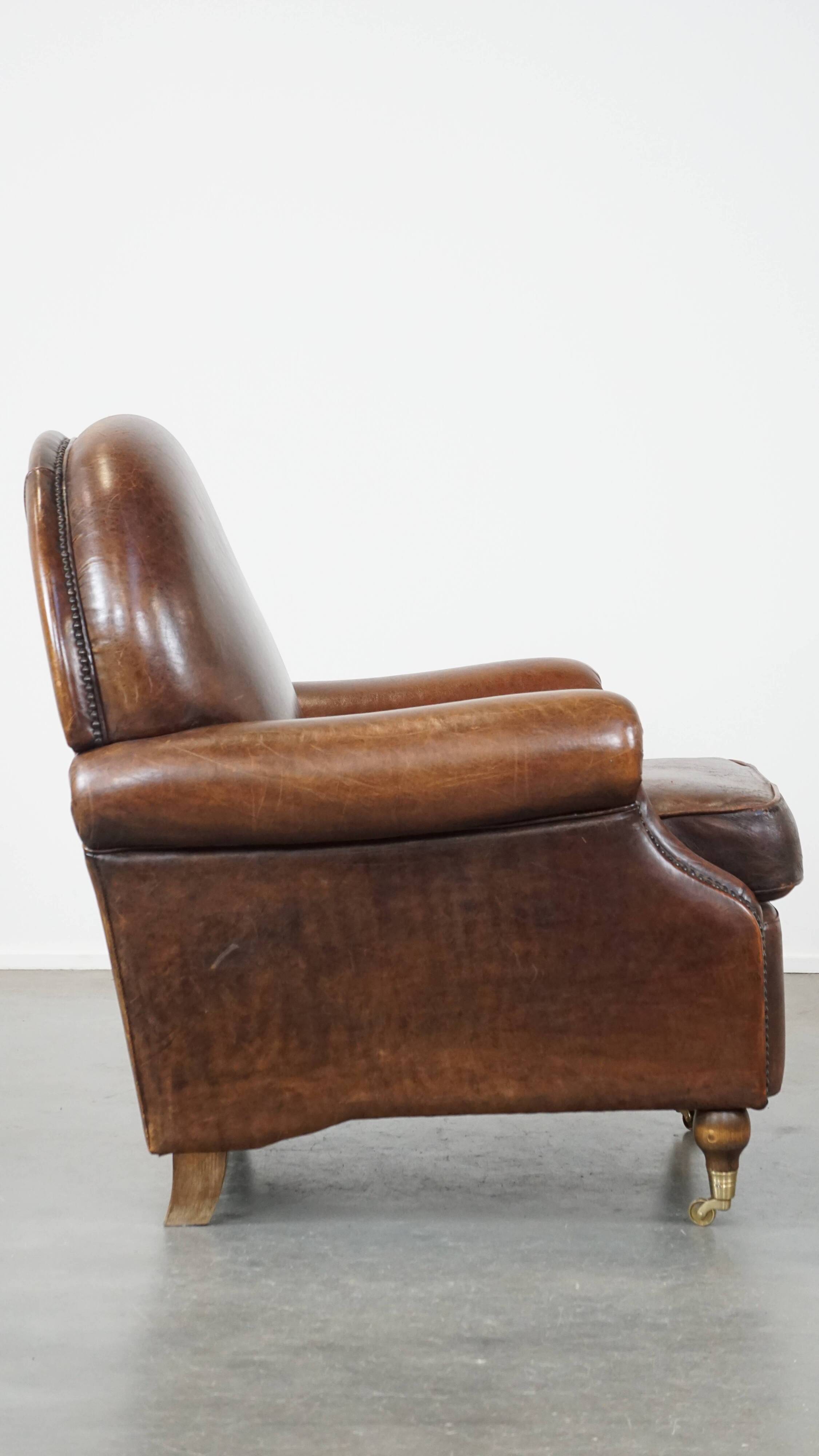 Sheep leather armchair on wheels