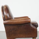 Sheep leather armchair on wheels