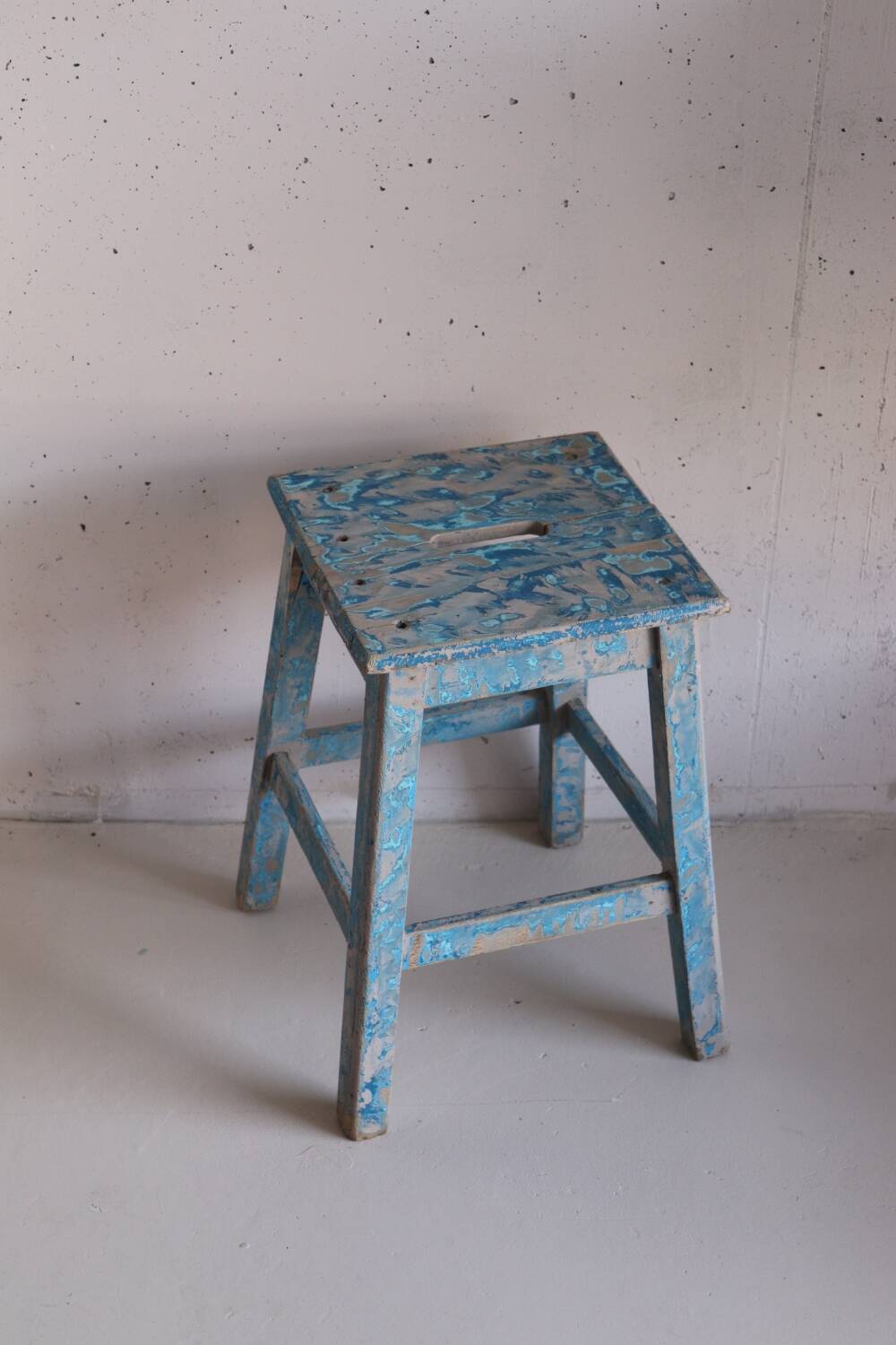 Blue patinated farm stool