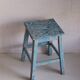 Blue patinated farm stool