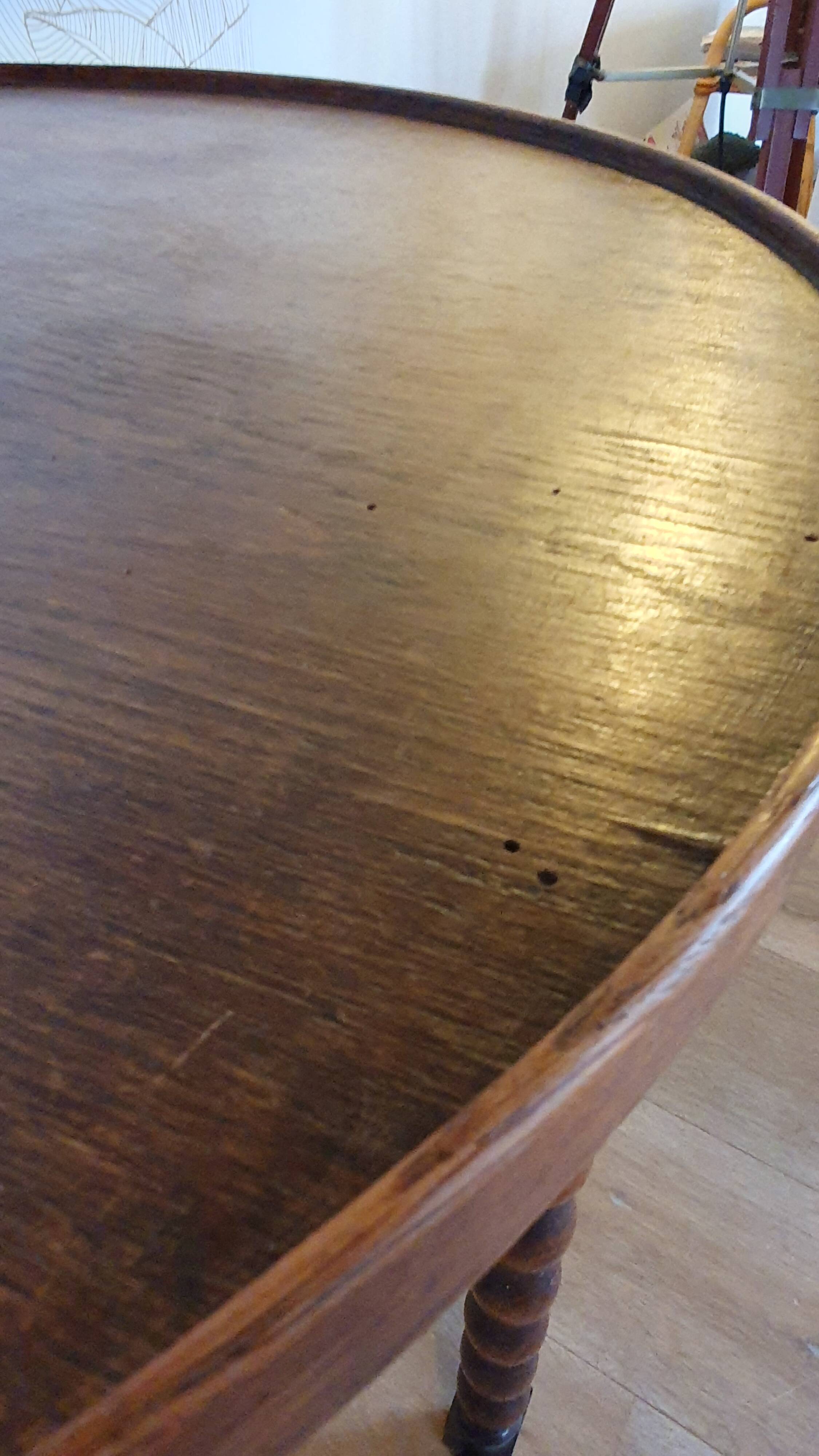 Round wooden table with beaded legs