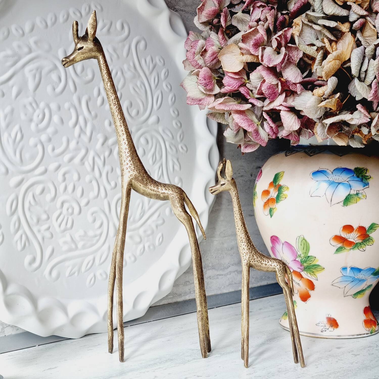 Stylized brass giraffes