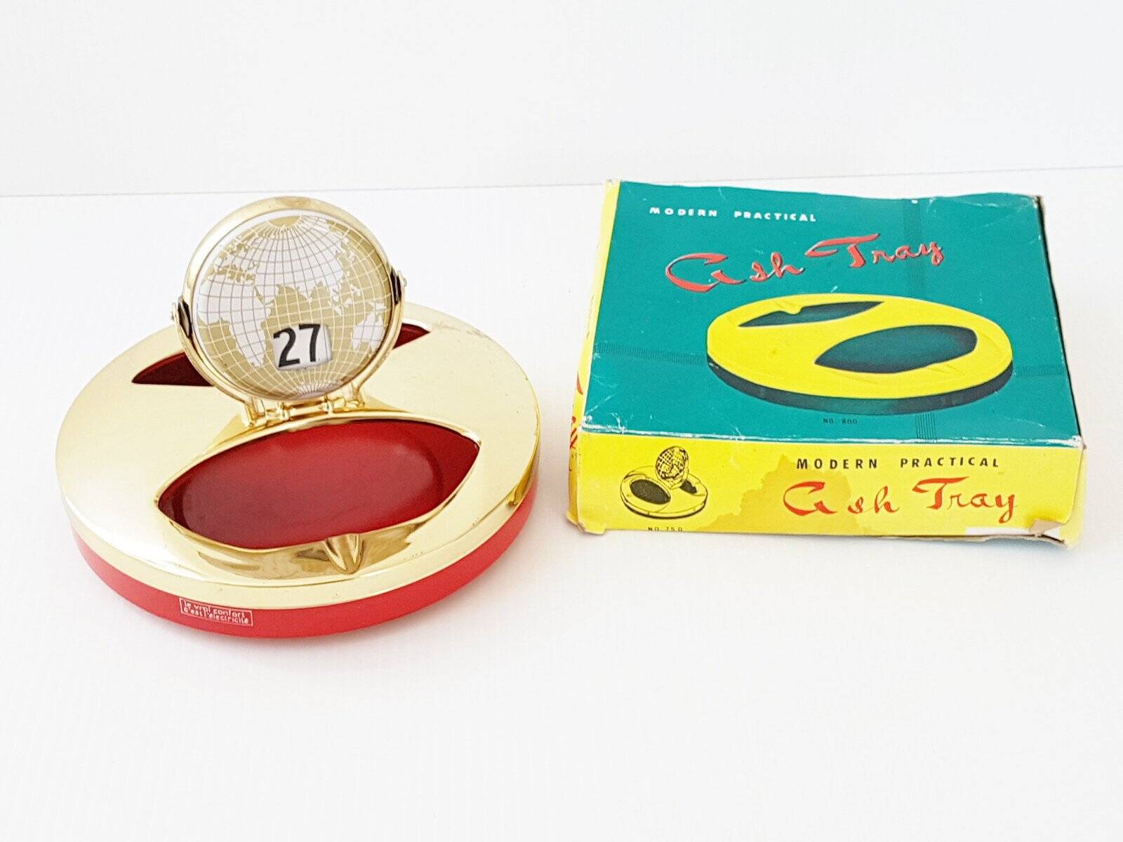 Vintage 1950s brass gold-plated globe perpetual calendar ashtray.