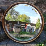 Old beveled round mirror