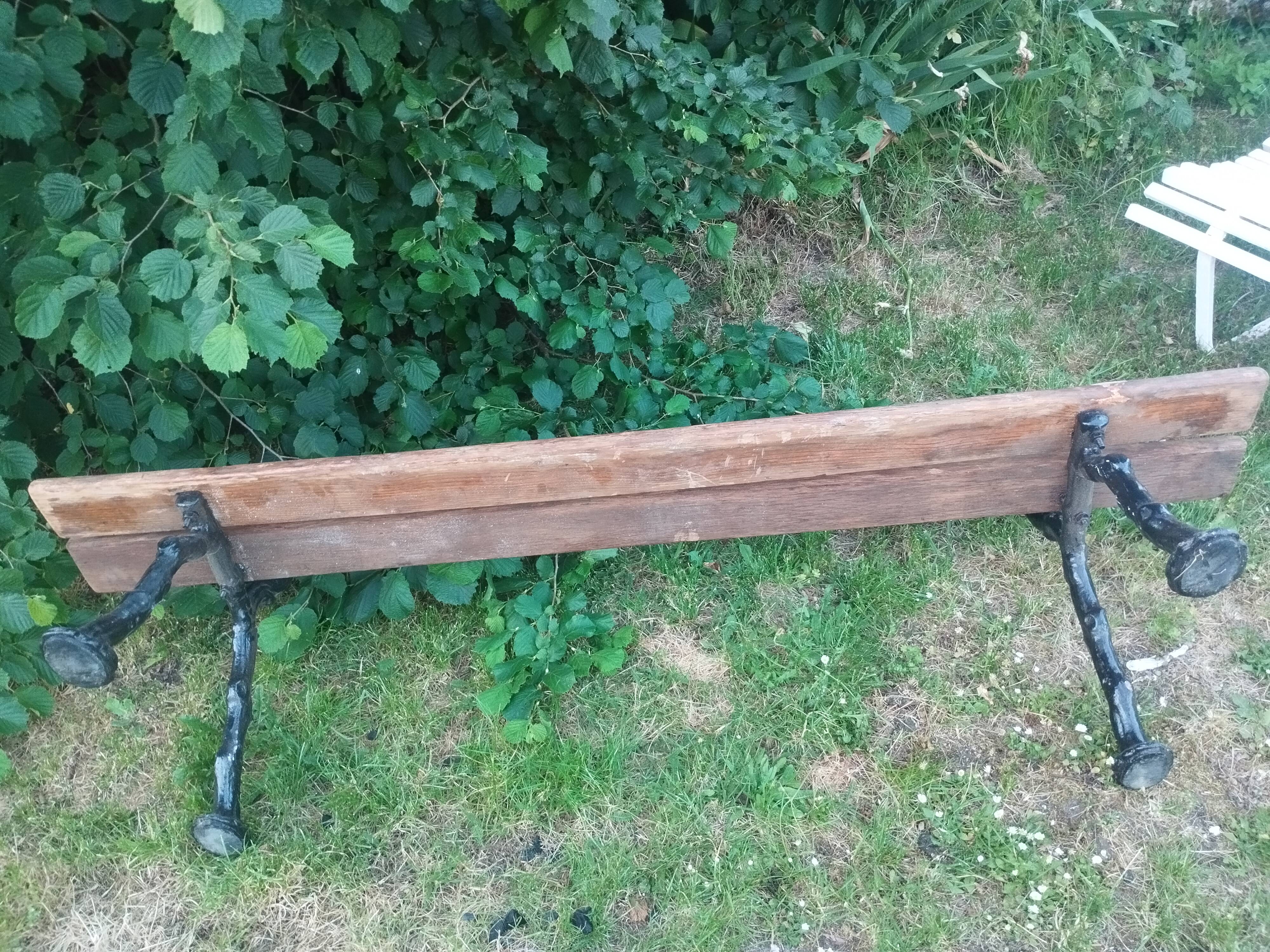 Antique garden bench with cast iron legs