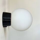 Pair of vintage Raak opaline and Bakelite wall lights, Netherlands 1970s