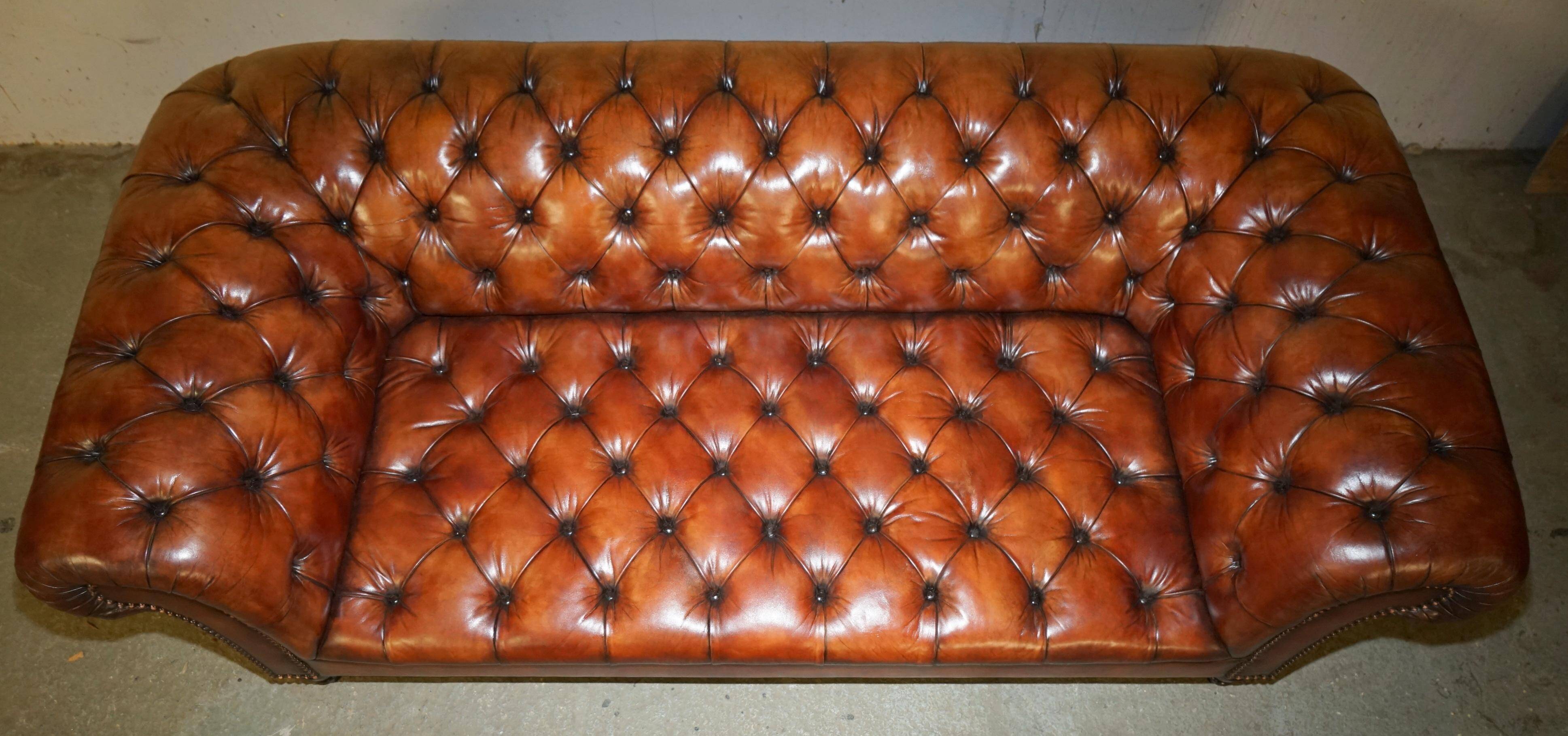Pair of Early Victorian leather Chesterfield sofas by George Smith.
