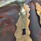 Pair of brass door handles with their cover plates