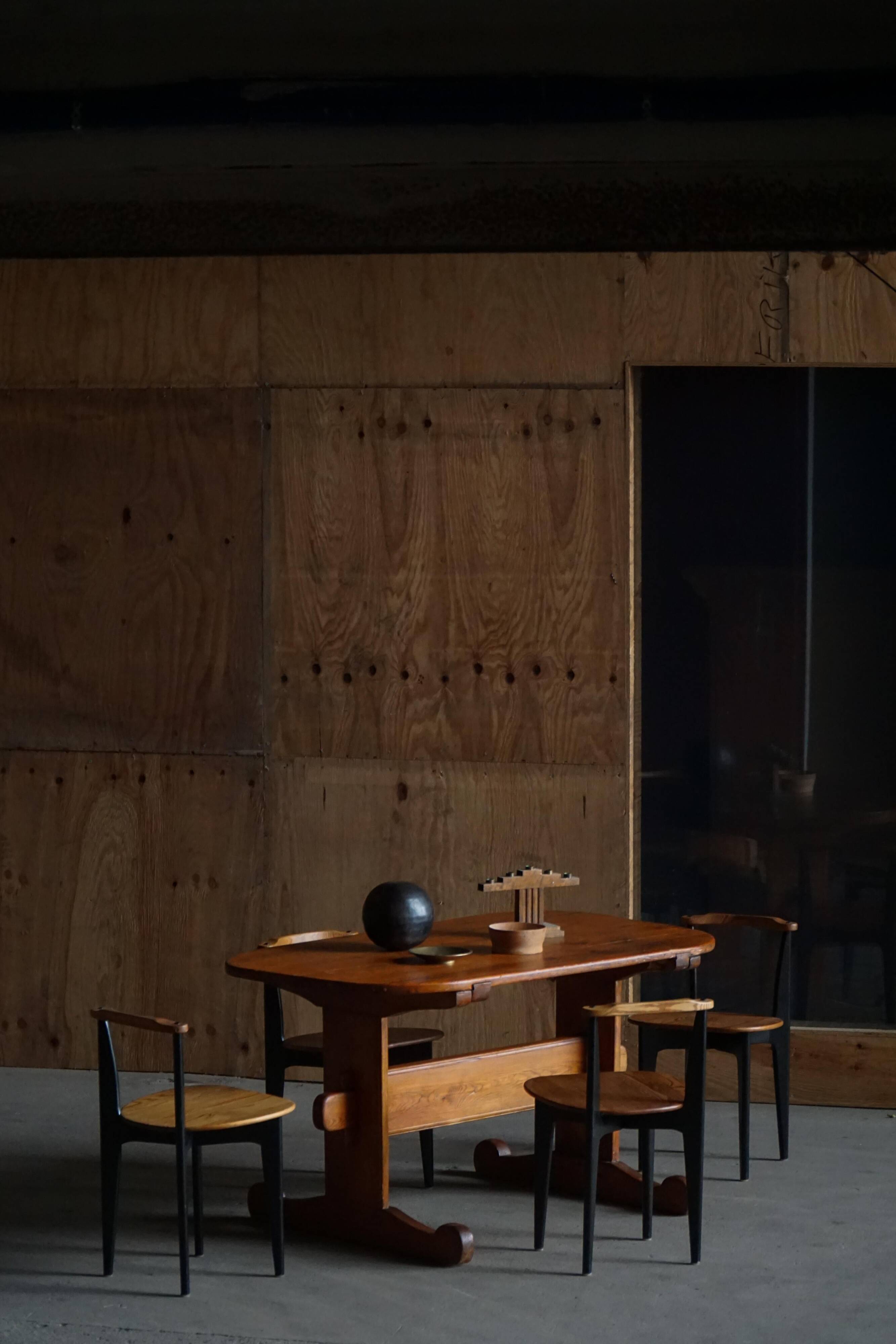 Primitive Swedish oval dining table in pine, early 20th century.