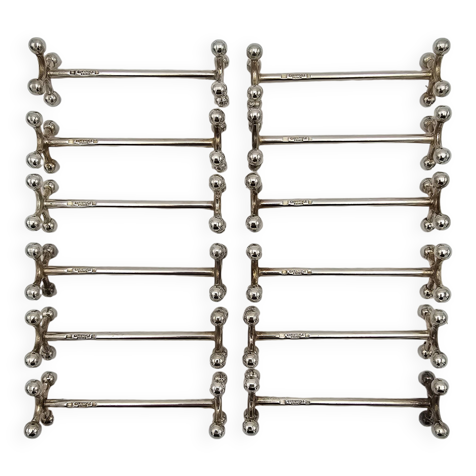 12 Christofle silver-plated knife holders