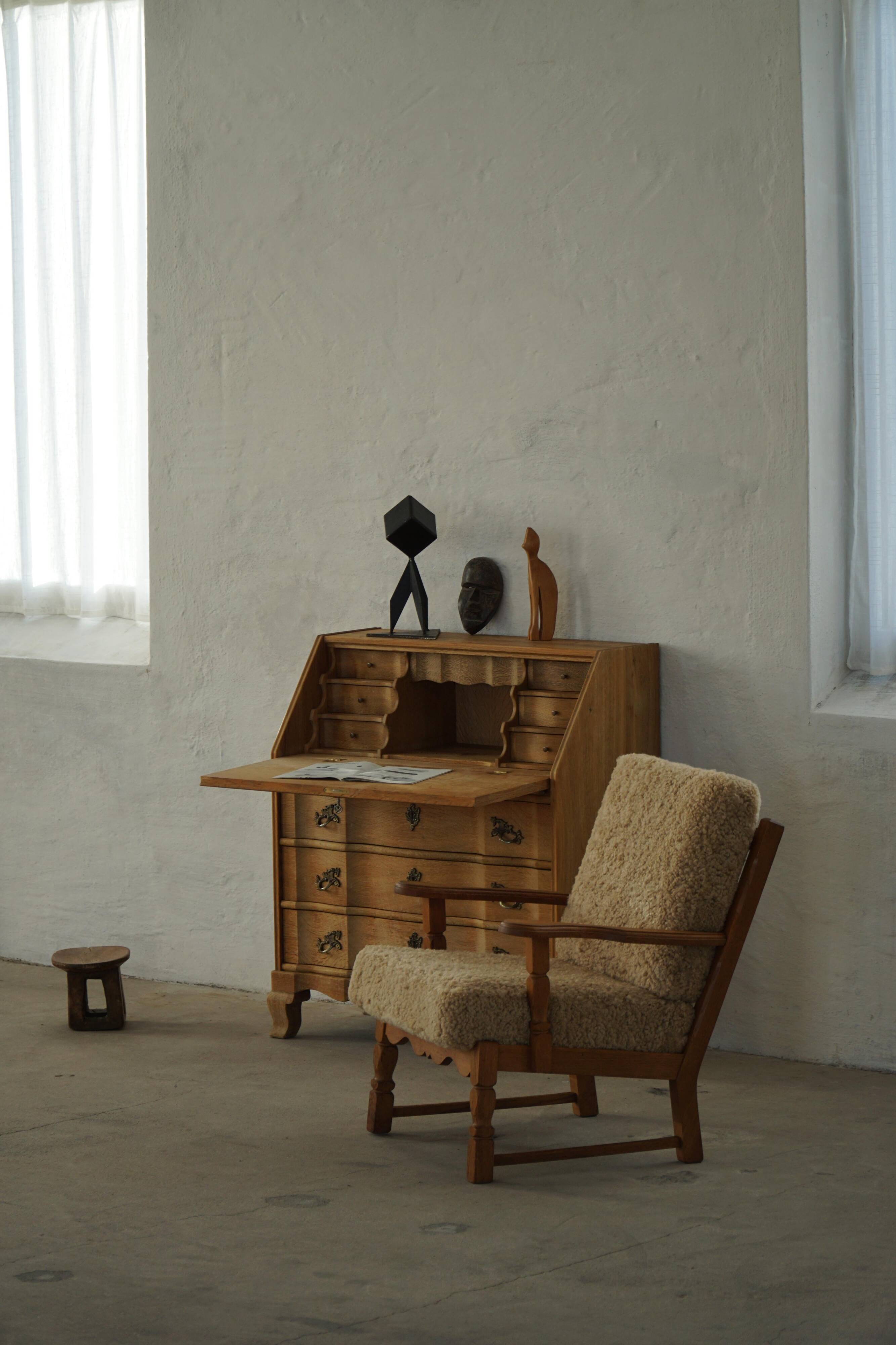 Danish modernist lounge chair in oak and lambswool, Henning Kjærnulf, 1960s