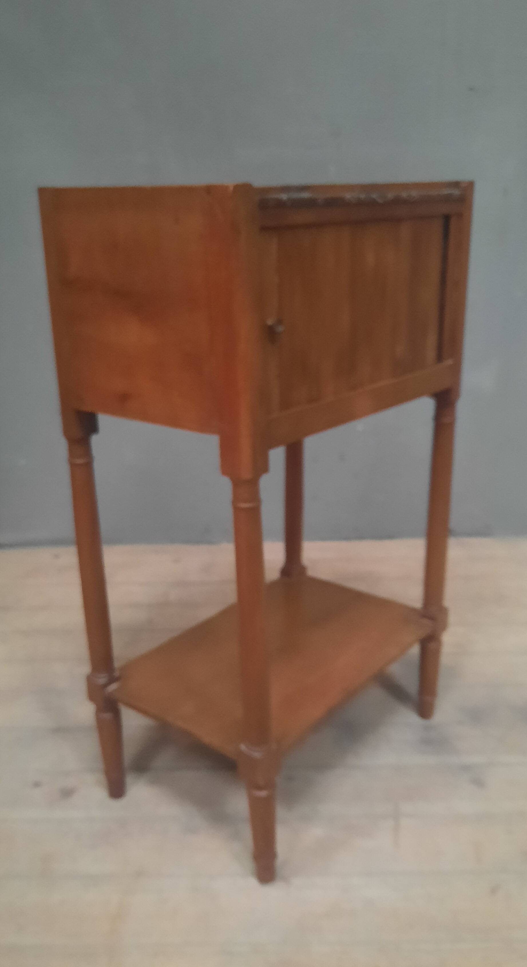 Curtained bedside table from the nineteenth century.