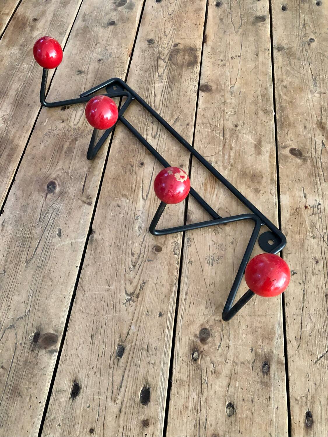 Red and black coat rack