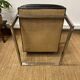 Vintage 1970s black leather armchair – metal frame