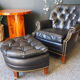 Chesterfield style leather armchair & footstool by Hancock & Moore