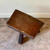 Brutalist tripod stool in dark wood