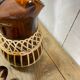 Carafe and glasses in amber glass and rattan