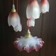 Suspension with tulips and a red scalloped lampshade.