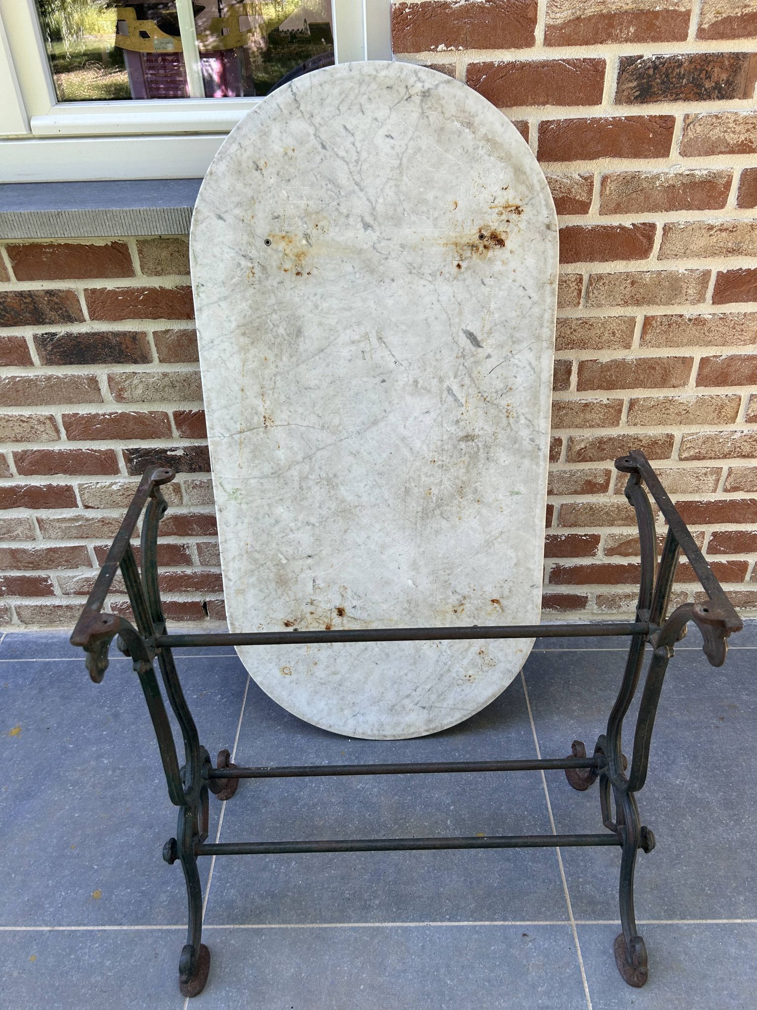 Art Nouveau cast iron and marble bistro table.