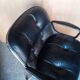 Fauteuil Charles Pollock cuir noir époque 1970