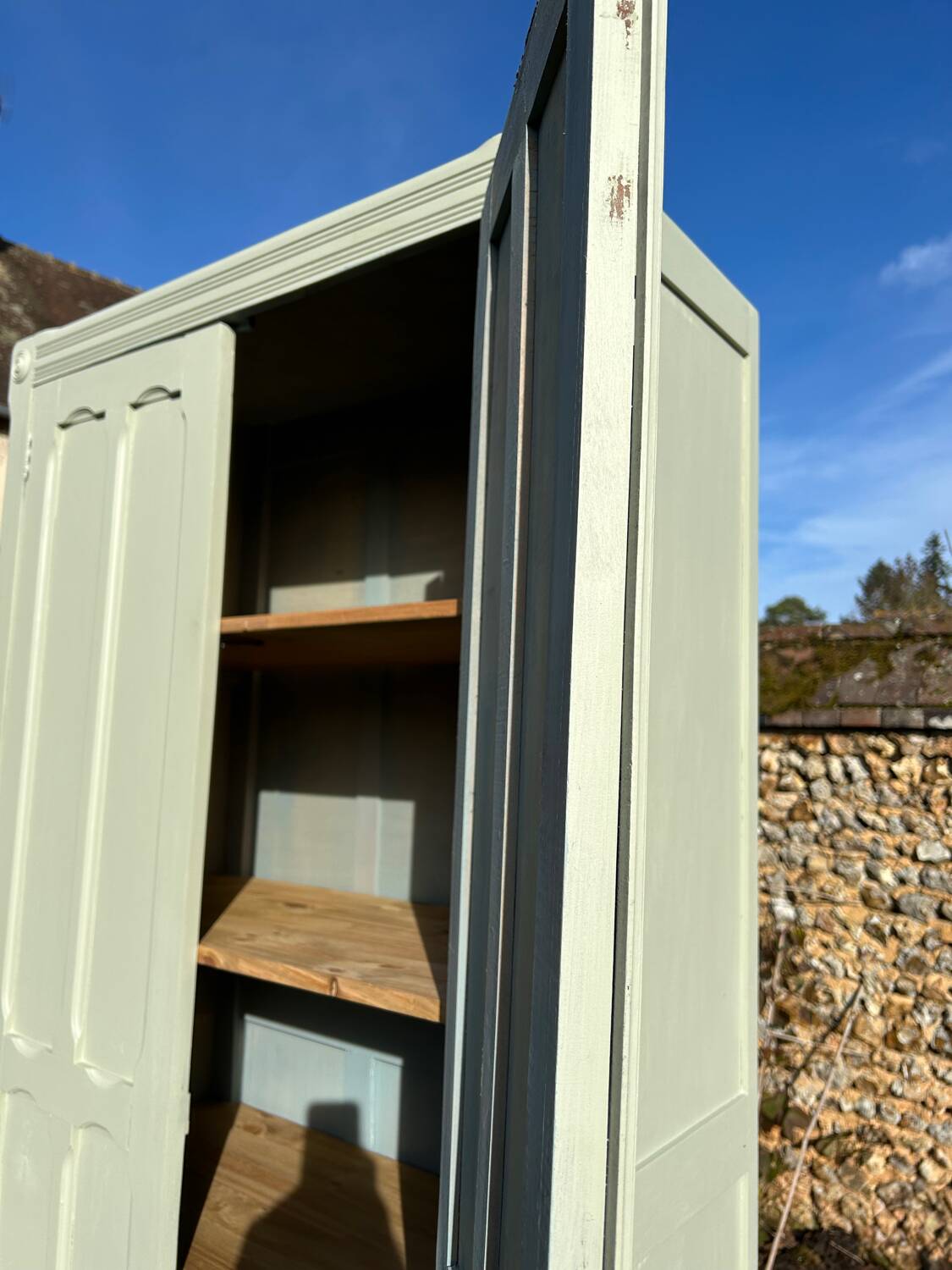 Restored vintage Parisian wardrobe from the 1930s in light green.