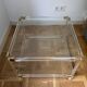 2 side tables in plexiglass, glass, and brass.