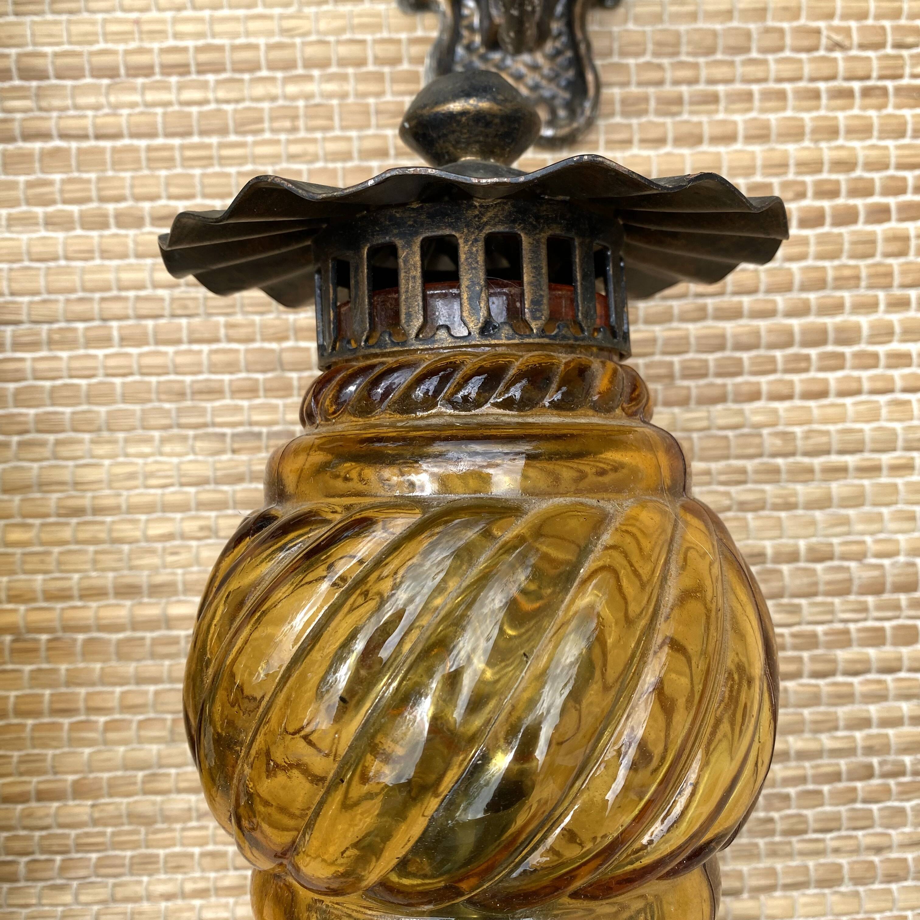 Medieval style metal and amber glass wall lamp