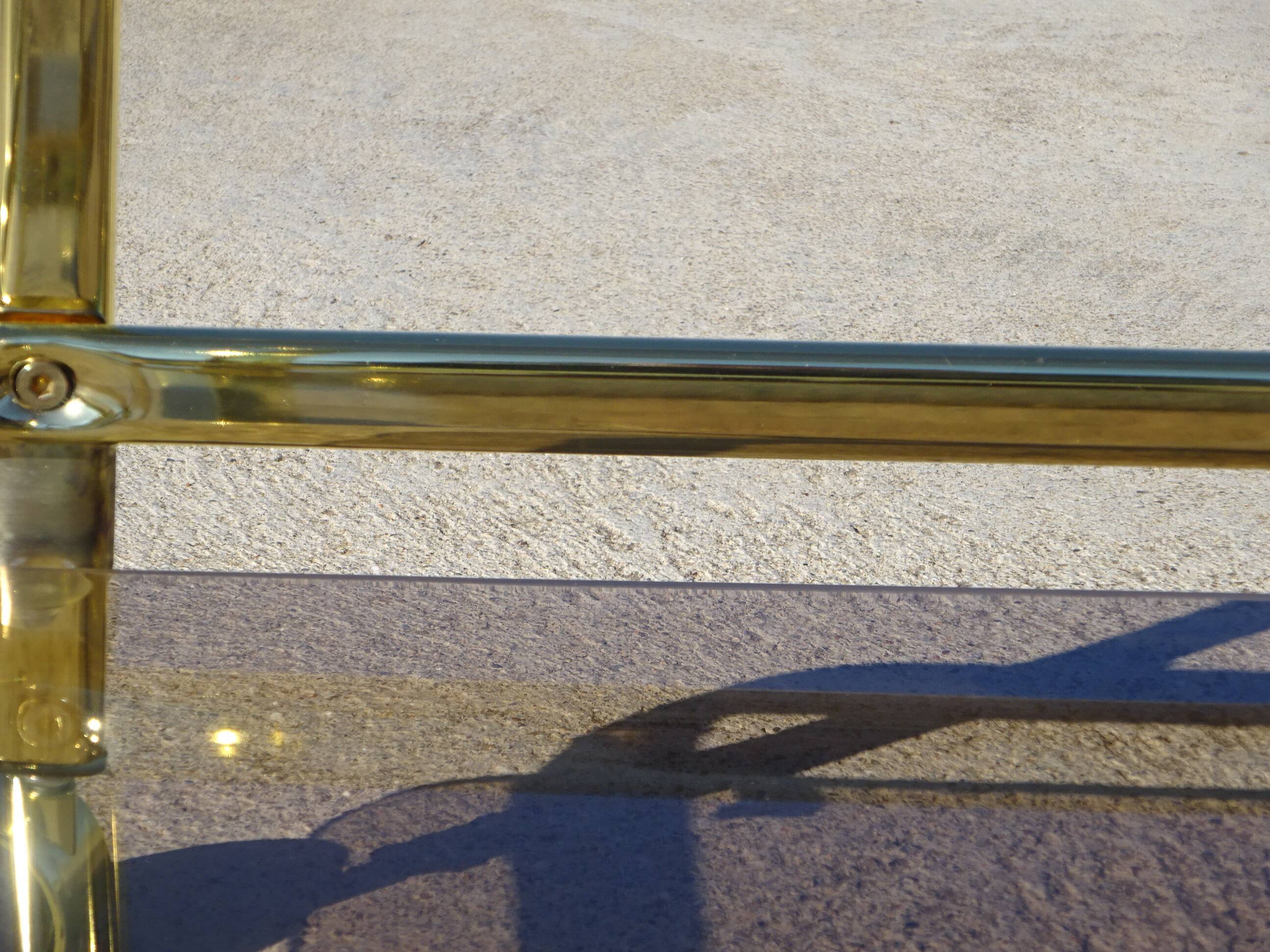 Golden metal and smoked glass dessert table