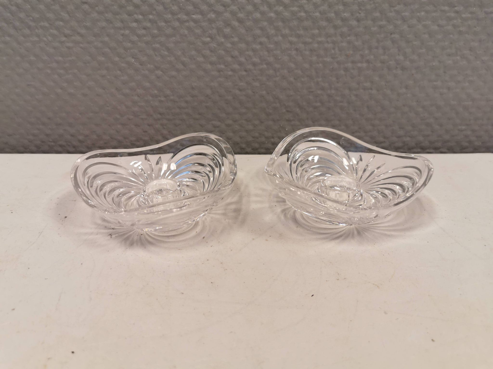 A set of beautiful rock crystal glass candle holders from Swedish Orrefors. Estimated 1970s.
