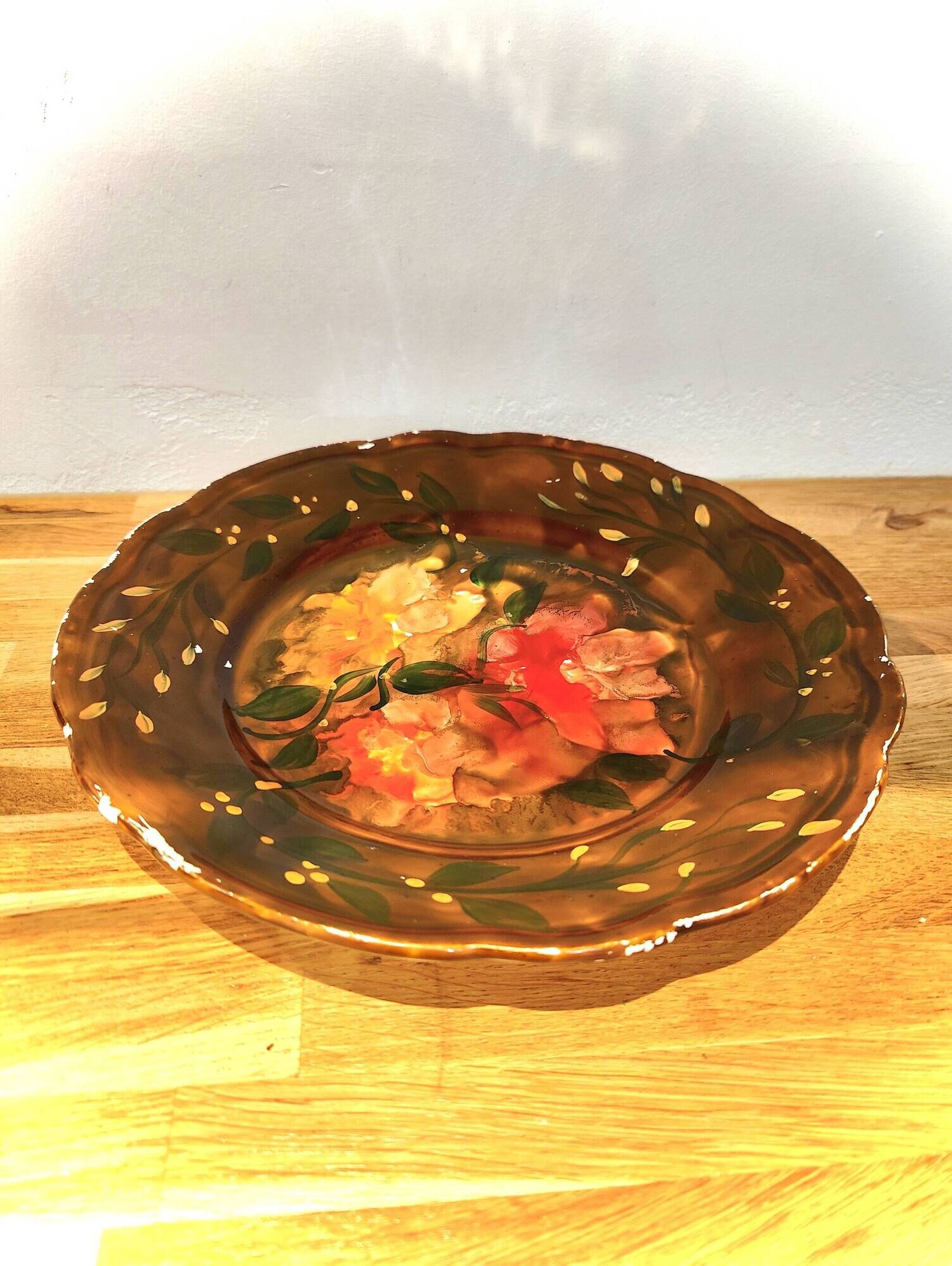 Decorative plate in brown faience