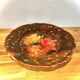 Decorative plate in brown faience